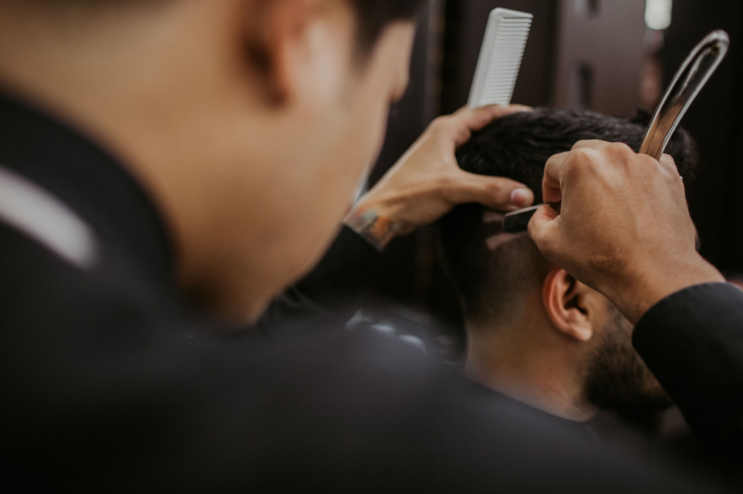 Modern The Blade barbershop interior with barber chairs and grooming stations